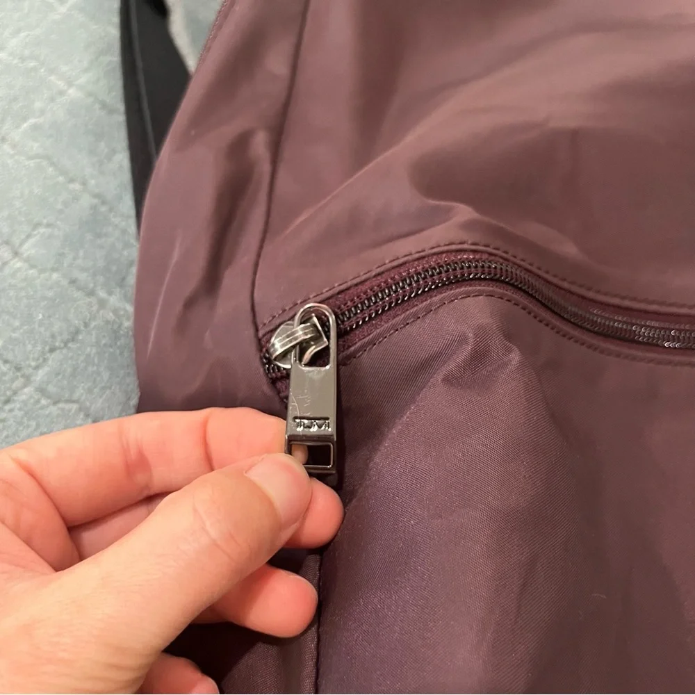 Tumi‎ maroon Backpack with Classic Design and Durable Build